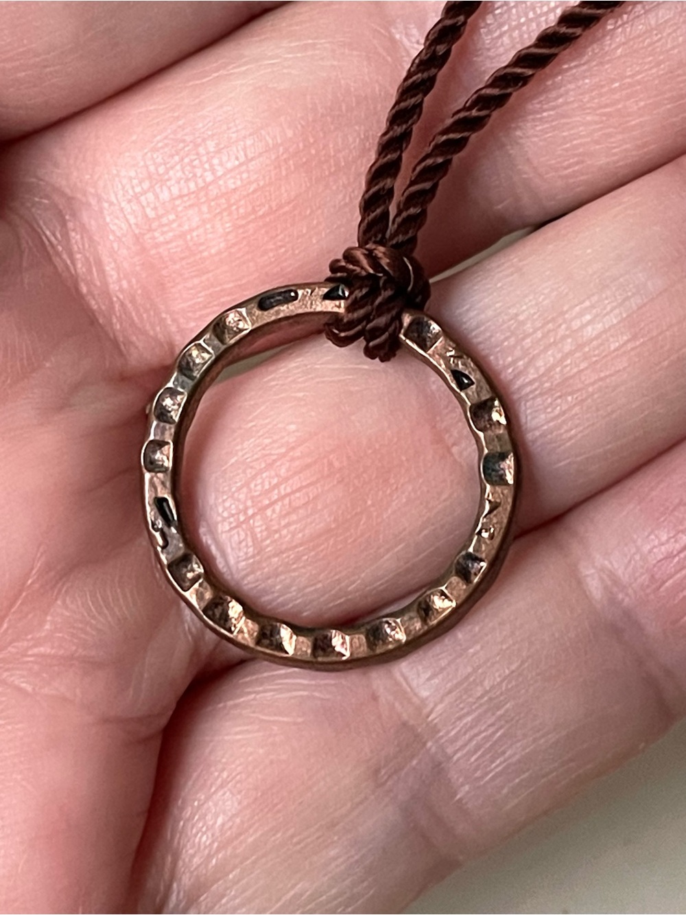 Vintage/style open copper metal pendant necklace on brown cord boho